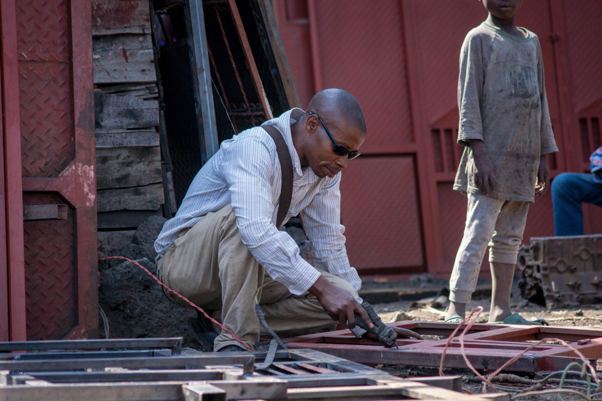 Welder at work in a metal workshop in Goma